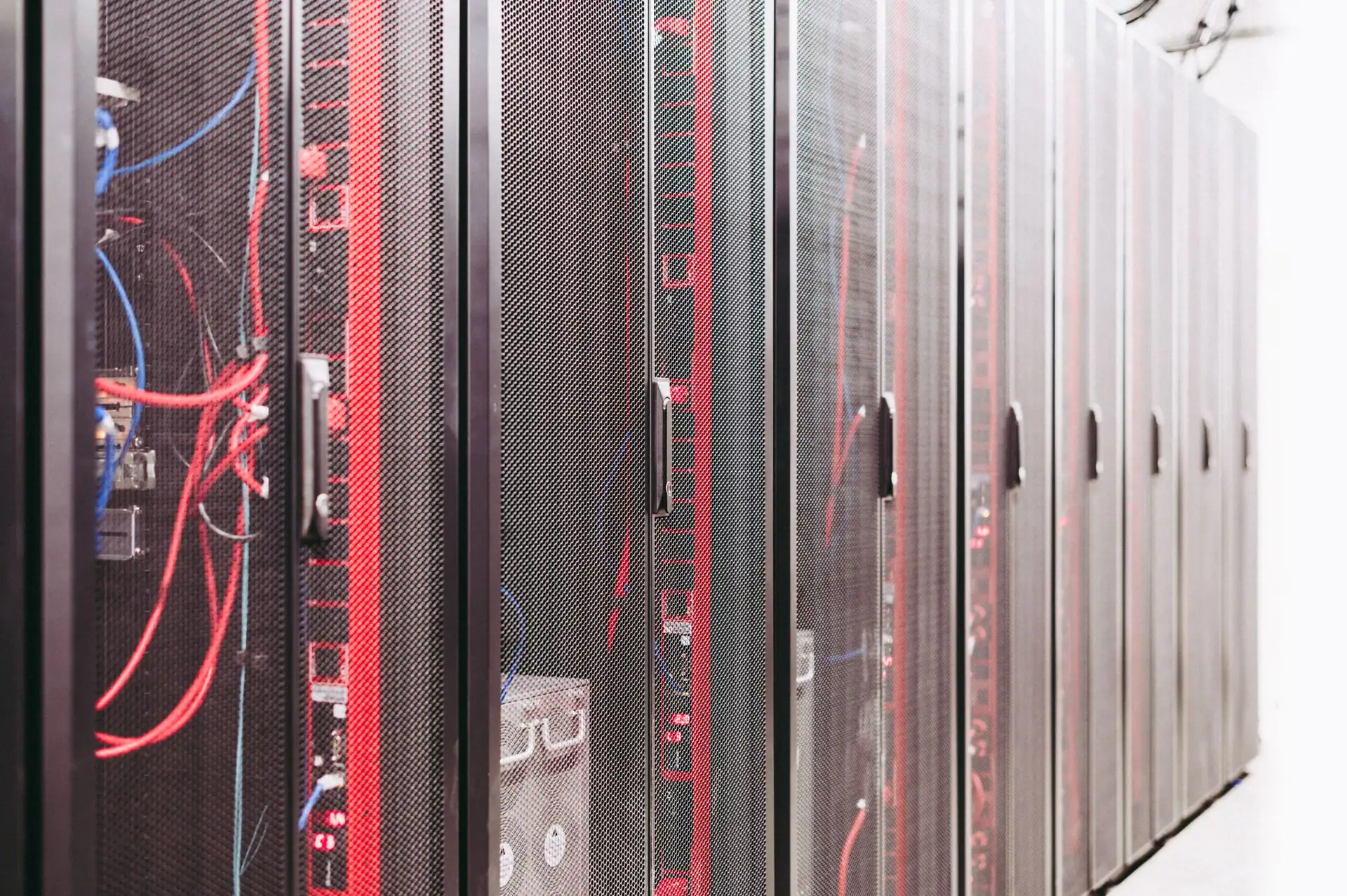 Rows of server cabinets in a data hall (illustrative stock photograph)